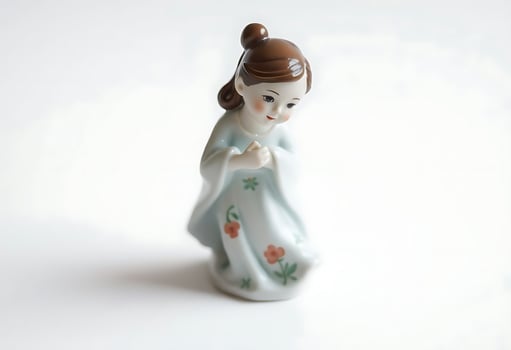 figurine of a woman in a blue dress photo