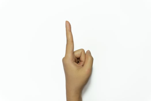 Hand finger sign number 1 isolated on white background. photo