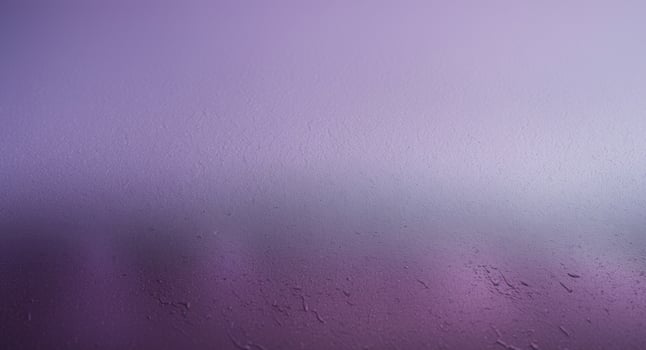 A purple and pink background with a blurred image photo