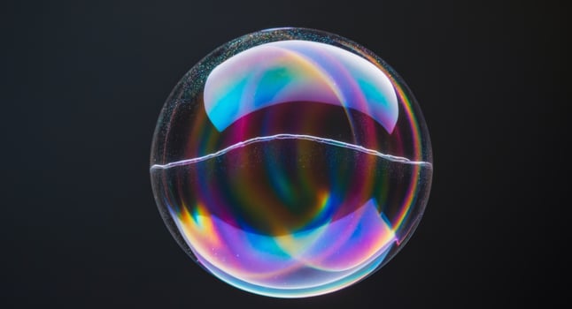 A soap bubble with a rainbow colored reflection photo