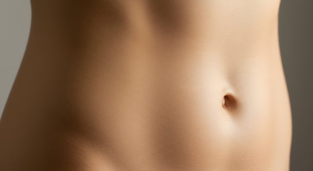 Close-up of a healthy female belly, representing clean beauty, perfect for bathroom cosmetics ads, intimate care branding, or natural product visuals. photo