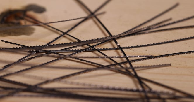 metal wood saw blades, multiple metal brittle woodworking blades, selective focus photo