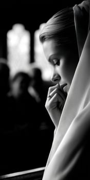 Pensive bride wearing veil in church before ceremony photo