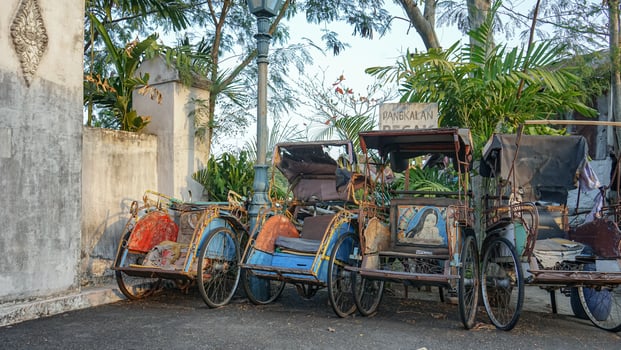 A rickshaw base on a sunny afternoon with a vintage feel in Yogyakarta, Indonesia photo