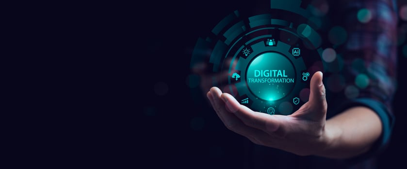 Hand holding glowing digital transformation icon with futuristic technology interface, AI chip, cloud computing, analytics and automation concept for innovation, smart business and digital strategy photo