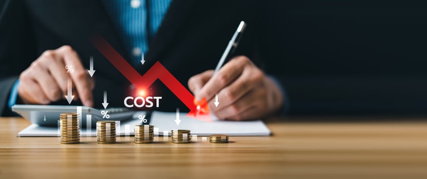 Business cost reduction strategy concept with stacked coins and red downward arrow, showing financial management, percentage decrease, budgeting, expense control, and company savings improvement photo