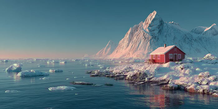 Snowy landscape with a red house by the frozen sea and majestic mountains at dawn in a remote location photo