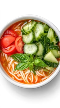 Refreshing noodle bowl with vegetables and herbs, served as light summer meal in a white bowl photo