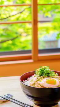 Rice bowl with egg and green onion in Japan, serene view from window photo