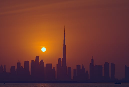 Beautiful sunset view of Dubai skyline with Burj Khalifa silhouette photo