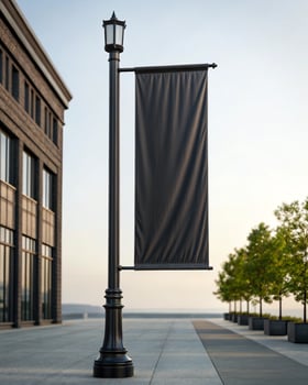 A black banner hanging from a street light photo