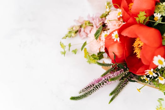 Beautiful bouquet with peony and flowers on white table photo