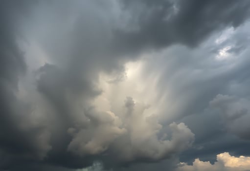 A large storm cloud is seen in the sky photo