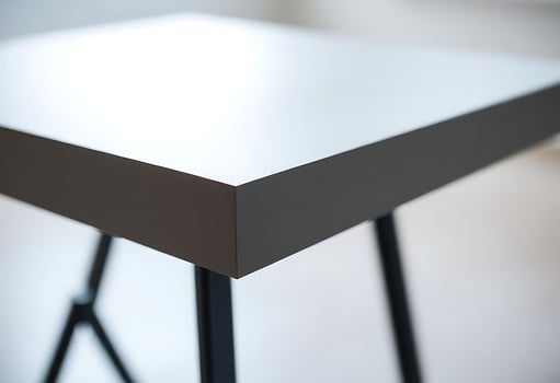 close up of a white table with black legs photo