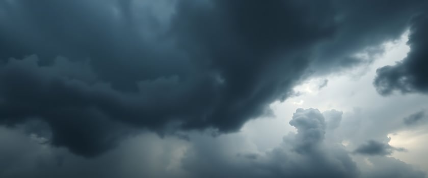 A dark stormy sky with dark clouds photo