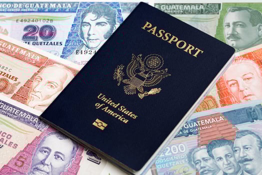 American passport on Guatemalan Quetzal photo