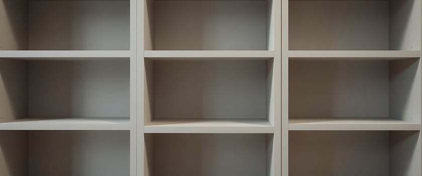 white bookcase with many shelves in it photo