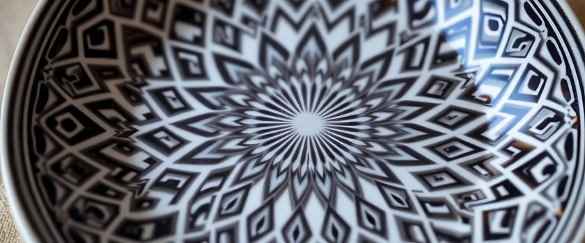 black and white bowl sitting on top of a table photo