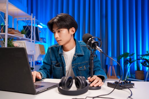Podcastor prepare podcast production with microphone and laptop in studio photo