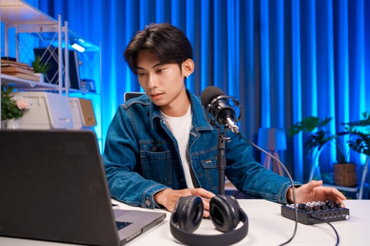 Young Asian Man Running Podcast Setup photo
