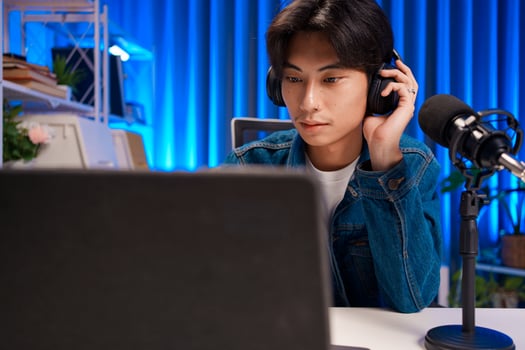 Asian Podcaster Monitoring Sound Quality photo