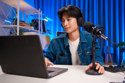 Young man interacting with audience during podcast photo
