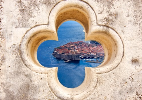 Old Town Dubrovnik and sea Through Stone Window View photo