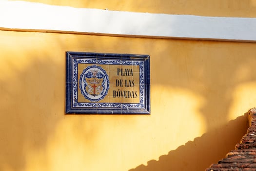Street sign of the Colonial building of Las Bovedas in the walled city of Cartagena de Indias, Colombia photo