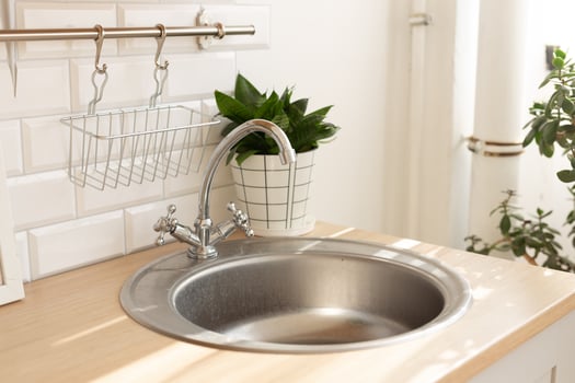 Kitchen silver sink modern decoration house stainless steel closeup at home photo