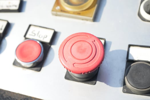 Control panel features prominent red emergency button photo
