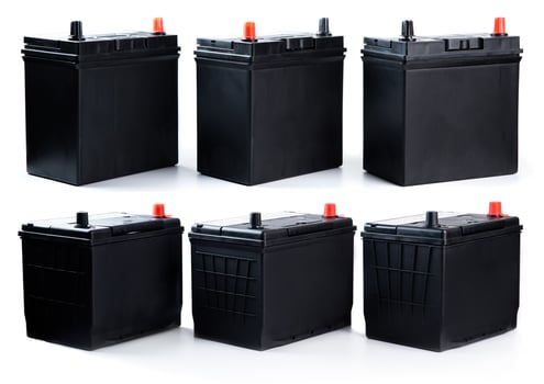 Set of six automotive batteries on white background. Different sizes for passenger cars and trucks. Ideal for parts shop, catalog, or replacement use. photo