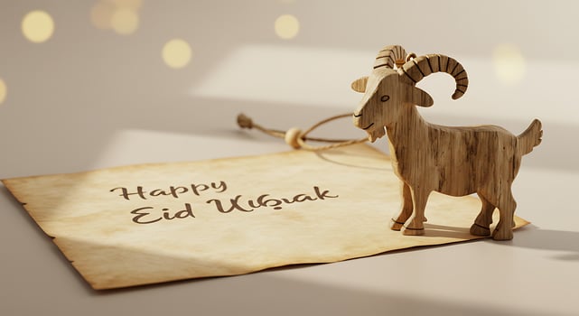Wooden Goat Figurine with a Message Celebrating a Special Occasion on Parchment photo
