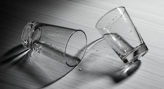 Empty Glasses with Water Droplets on a Wood Surface photo