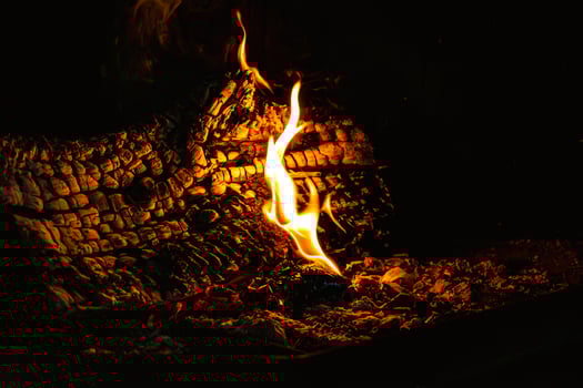 Fire in a fireplace in the living room, indoors photo