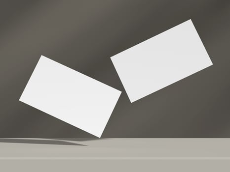 Two clean business cards levitating in balanced perspective over a neutral surface photo