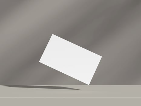 Minimalist business card mockup floating on grey background with dramatic lighting photo