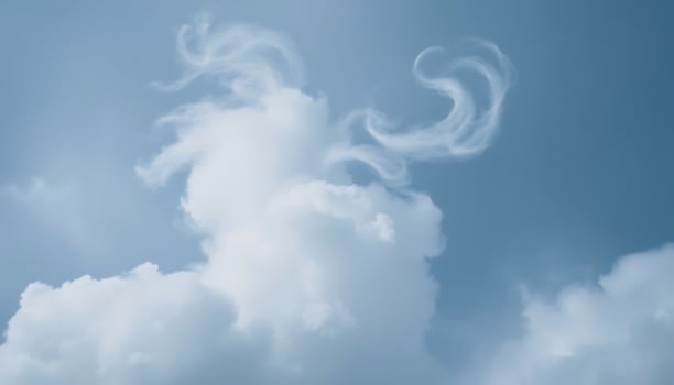 A white cloud with a horn on top of it photo