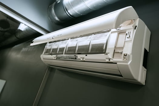 Efficient wall-mounted air conditioning unit installed in a modern indoor space for optimal cooling comfort photo