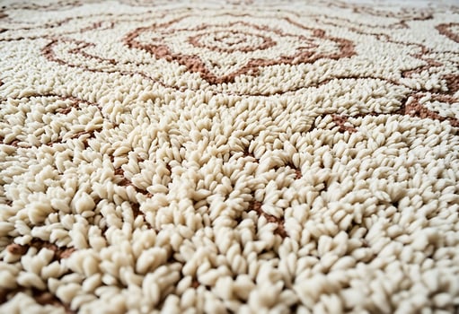 A close up of a rug with a large design photo