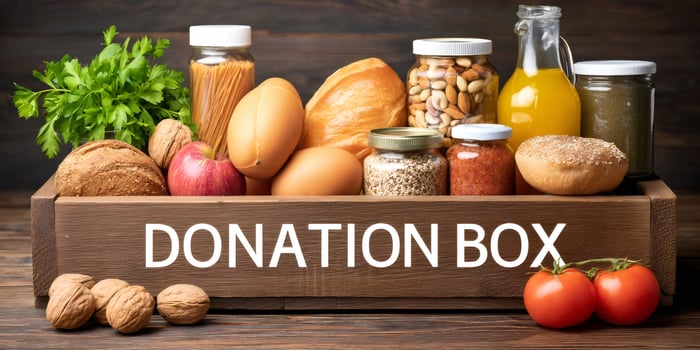 Donation box full of groceries providing food help photo