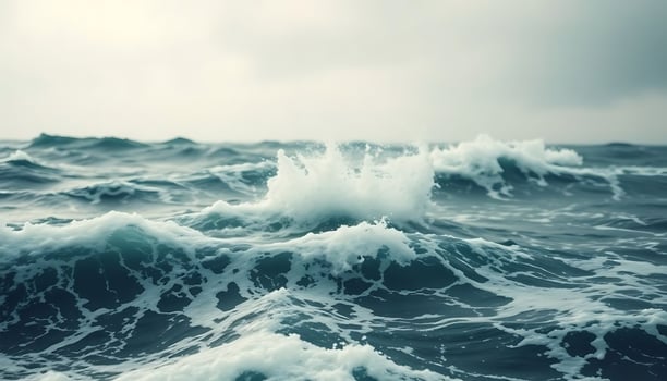 large body of water with waves in it photo