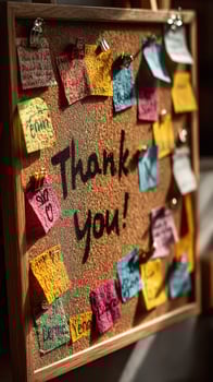 Colorful thank you notes displayed on a corkboard in a cozy indoor setting during daylight hours photo