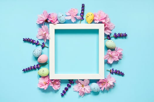 Flowers Background Easter Spring Background White Frame with Pink Flowers Lavender and Pastel Eggs photo