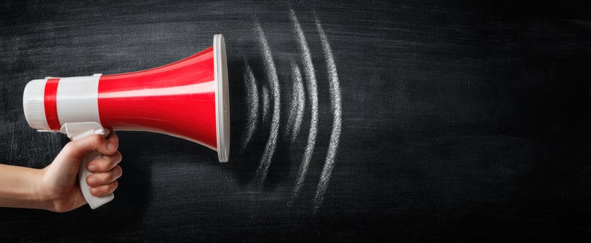 The Megaphone Representing Communication and Sound Waves on Blackboard photo