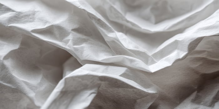 Close up of textured crumpled white paper surface photo