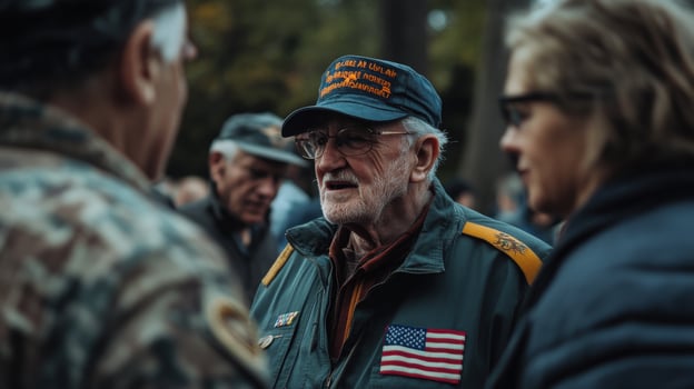 A veteran in conversation with people at an outdoor gathering photo