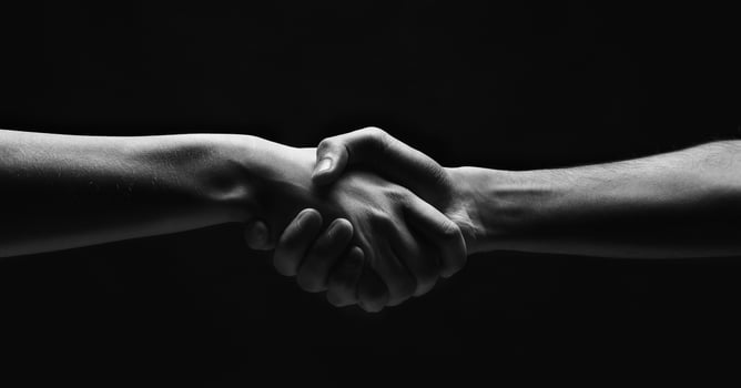 First meeting. Woman and man handshaking on black background, panorama, copy space photo