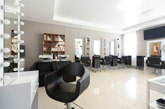 Barber chair for client on front background at interior of beauty salon photo