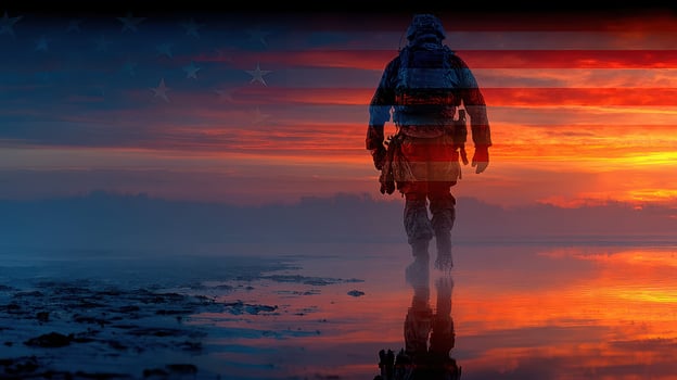 Soldier walking along a reflective shoreline at sunset with an American flag overlaying the background photo