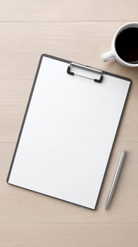 Blank clipboard with white paper, silver pen, and coffee cup on wooden table, ideal for notes, sketches, or creative ideas with copy space photo